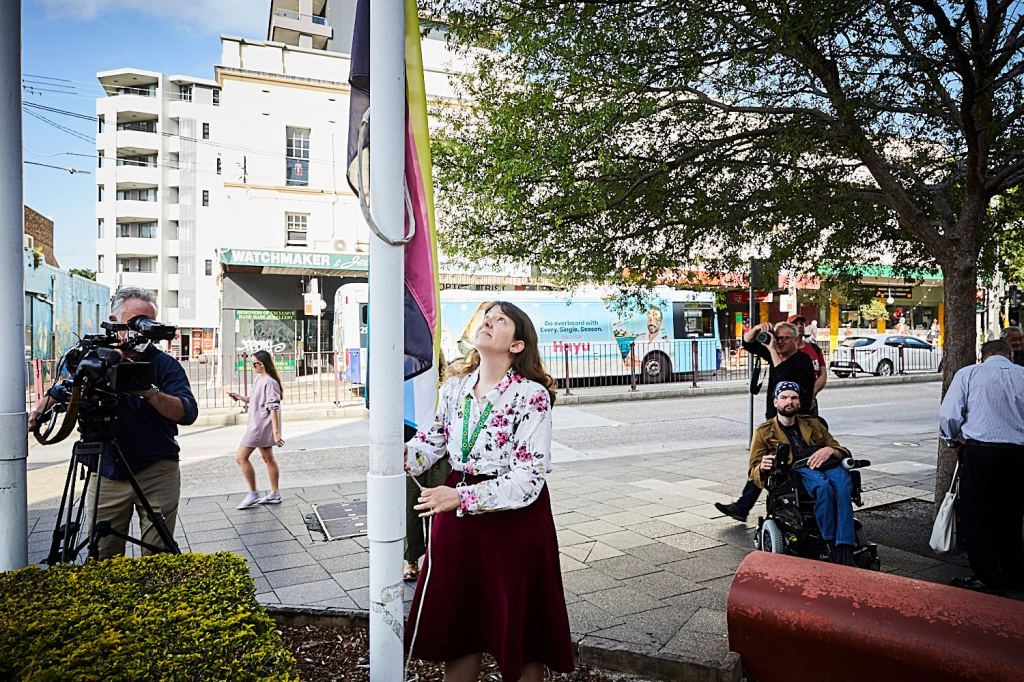 Close up of the flag being raised. 